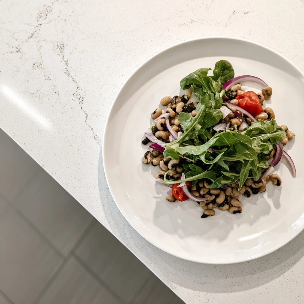 Finished Black-Eyed Pea Salad in a bowl garnished with parsley.