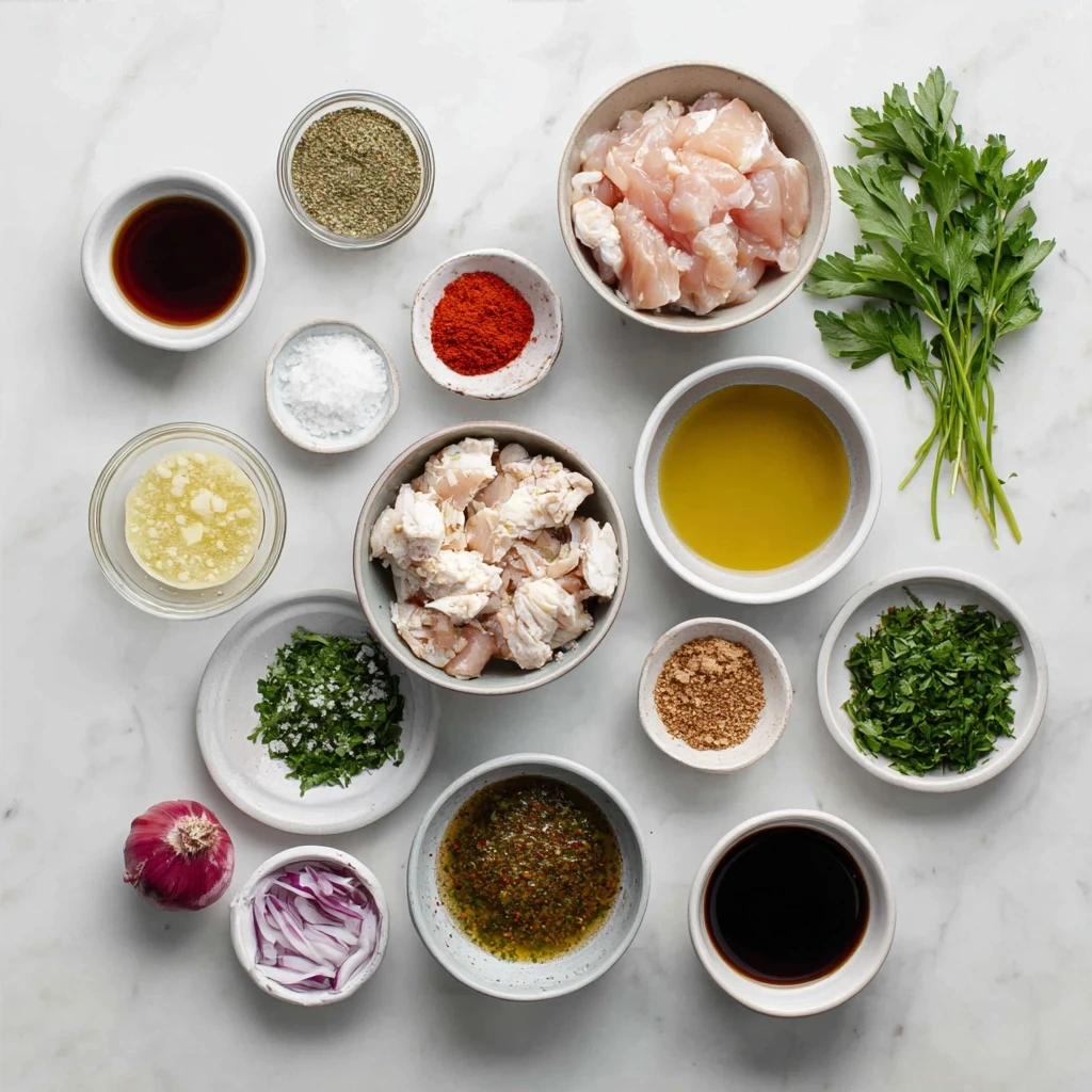 Chicken shawarma ingredients including chicken, spices, lemon, and olive oil.