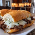 Close-up of homemade Crockpot French Dip Sandwich on white plate