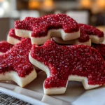 Home cook, taken with iPhone 15 Pro. Close-up slight angle of freshly prepared Red Velvet Bear Cookies on white plate. Rich inviting --ar 4:3 --style raw --s 260