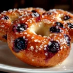Homemade Blueberry Bagels on white plate